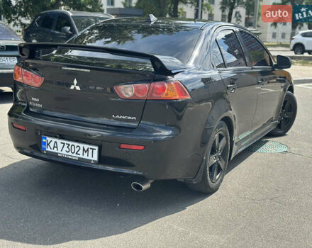 Черный Мицубиси Лансер, объемом двигателя 2 л и пробегом 295 тыс. км за 7000 $, фото 3 на Automoto.ua