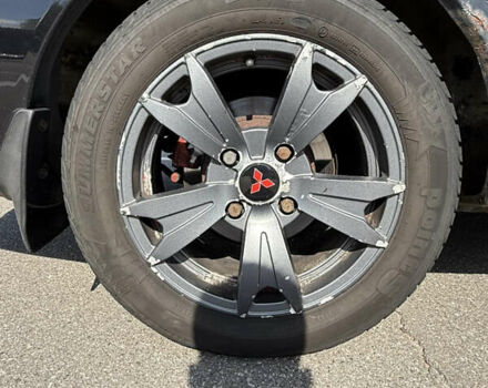 Черный Мицубиси Лансер, объемом двигателя 1.6 л и пробегом 321 тыс. км за 5000 $, фото 19 на Automoto.ua