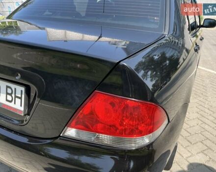 Чорний Міцубісі Lancer, об'ємом двигуна 1.6 л та пробігом 296 тис. км за 4200 $, фото 21 на Automoto.ua