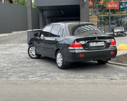 Черный Мицубиси Лансер, объемом двигателя 1.6 л и пробегом 167 тыс. км за 4850 $, фото 1 на Automoto.ua