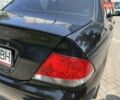 Чорний Міцубісі Lancer, об'ємом двигуна 1.6 л та пробігом 296 тис. км за 4200 $, фото 21 на Automoto.ua