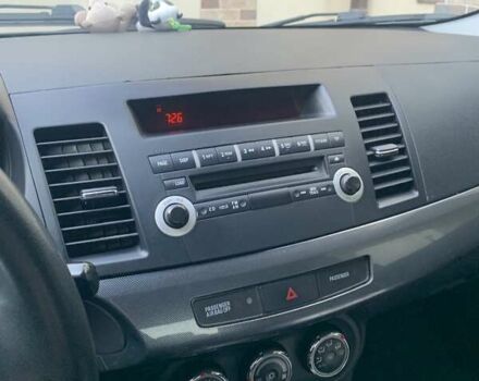 Черный Мицубиси Лансер, объемом двигателя 2 л и пробегом 210 тыс. км за 7000 $, фото 6 на Automoto.ua