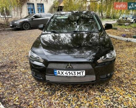 Черный Мицубиси Лансер, объемом двигателя 2 л и пробегом 260 тыс. км за 6100 $, фото 12 на Automoto.ua