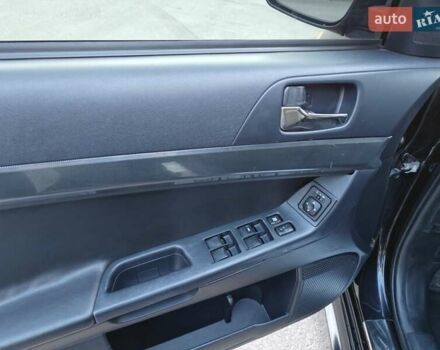 Черный Мицубиси Лансер, объемом двигателя 2 л и пробегом 245 тыс. км за 5600 $, фото 11 на Automoto.ua