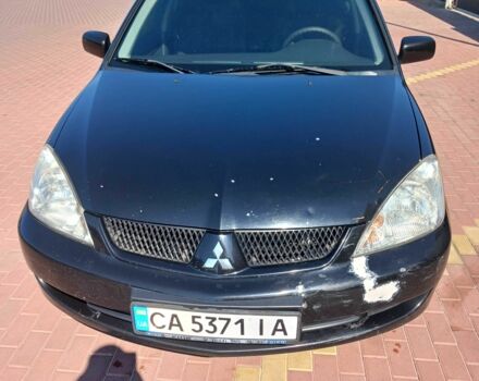 Черный Мицубиси Лансер, объемом двигателя 1.6 л и пробегом 409 тыс. км за 3000 $, фото 1 на Automoto.ua