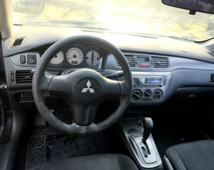 Черный Мицубиси Лансер, объемом двигателя 1.6 л и пробегом 243 тыс. км за 3200 $, фото 8 на Automoto.ua