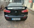 Черный Мицубиси Лансер, объемом двигателя 2 л и пробегом 162 тыс. км за 7500 $, фото 3 на Automoto.ua