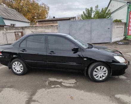 Черный Мицубиси Лансер, объемом двигателя 1.6 л и пробегом 270 тыс. км за 3800 $, фото 2 на Automoto.ua