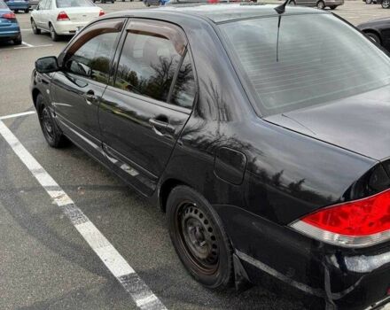 Чорний Міцубісі Lancer, об'ємом двигуна 1.6 л та пробігом 245 тис. км за 4500 $, фото 10 на Automoto.ua