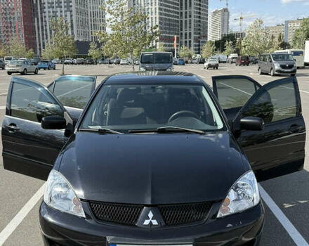 Черный Мицубиси Лансер, объемом двигателя 1.6 л и пробегом 321 тыс. км за 5000 $, фото 21 на Automoto.ua