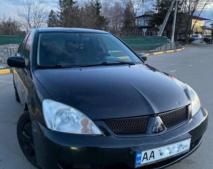 Чорний Міцубісі Lancer, об'ємом двигуна 1.58 л та пробігом 327 тис. км за 4000 $, фото 2 на Automoto.ua