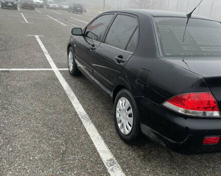 Черный Мицубиси Лансер, объемом двигателя 1.58 л и пробегом 214 тыс. км за 4400 $, фото 11 на Automoto.ua