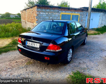 Чорний Міцубісі Lancer, об'ємом двигуна 1.6 л та пробігом 219 тис. км за 4800 $, фото 2 на Automoto.ua
