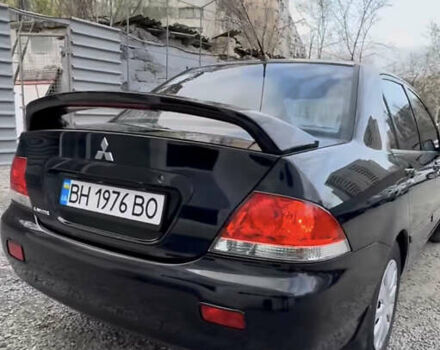 Черный Мицубиси Лансер, объемом двигателя 1.58 л и пробегом 469 тыс. км за 4600 $, фото 1 на Automoto.ua