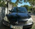 Чорний Міцубісі Lancer, об'ємом двигуна 1.6 л та пробігом 294 тис. км за 6500 $, фото 7 на Automoto.ua