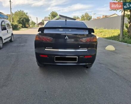 Черный Мицубиси Лансер, объемом двигателя 2 л и пробегом 230 тыс. км за 7000 $, фото 20 на Automoto.ua