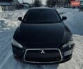 Черный Мицубиси Лансер, объемом двигателя 2 л и пробегом 330 тыс. км за 5100 $, фото 1 на Automoto.ua