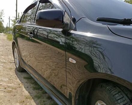 Черный Мицубиси Лансер, объемом двигателя 2 л и пробегом 214 тыс. км за 6300 $, фото 4 на Automoto.ua