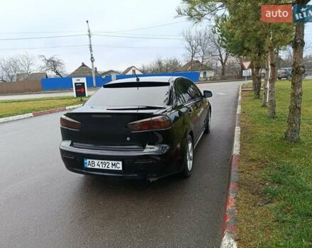 Черный Мицубиси Лансер, объемом двигателя 2 л и пробегом 200 тыс. км за 5100 $, фото 13 на Automoto.ua