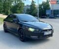 Черный Мицубиси Лансер, объемом двигателя 2 л и пробегом 210 тыс. км за 4999 $, фото 1 на Automoto.ua