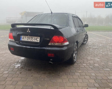 Черный Мицубиси Лансер, объемом двигателя 1.58 л и пробегом 211 тыс. км за 6333 $, фото 6 на Automoto.ua
