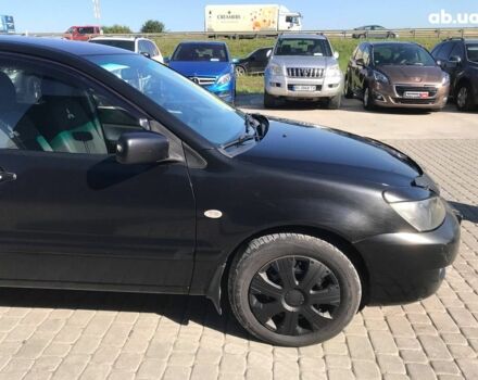 Черный Мицубиси Лансер, объемом двигателя 1.6 л и пробегом 356 тыс. км за 4590 $, фото 8 на Automoto.ua