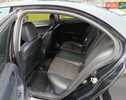 Черный Мицубиси Лансер, объемом двигателя 2 л и пробегом 200 тыс. км за 5100 $, фото 11 на Automoto.ua