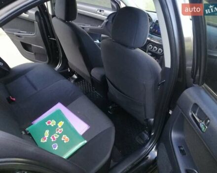 Мицубиси Лансер 2008 в Киеве на Automoto.ua Черный Мицубиси Лансер, объемом двигателя 2 л и пробегом 196 тыс. км за 5500 $, фото 25 на Automoto.ua