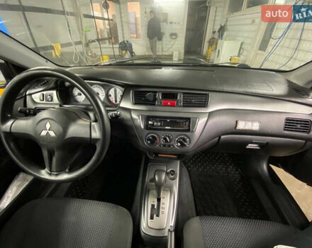 Чорний Міцубісі Lancer, об'ємом двигуна 1.58 л та пробігом 327 тис. км за 4000 $, фото 11 на Automoto.ua