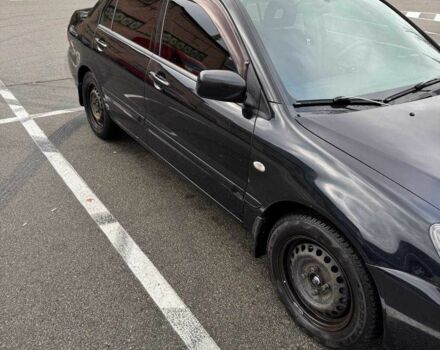 Чорний Міцубісі Lancer, об'ємом двигуна 1.6 л та пробігом 245 тис. км за 4500 $, фото 2 на Automoto.ua