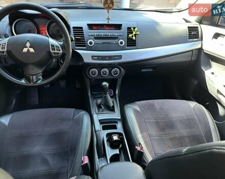 Черный Мицубиси Лансер, объемом двигателя 2 л и пробегом 230 тыс. км за 7000 $, фото 14 на Automoto.ua