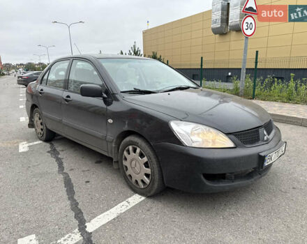 Чорний Міцубісі Lancer, об'ємом двигуна 1.58 л та пробігом 388 тис. км за 2300 $, фото 3 на Automoto.ua