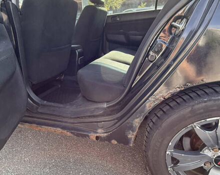 Черный Мицубиси Лансер, объемом двигателя 1.6 л и пробегом 321 тыс. км за 5000 $, фото 36 на Automoto.ua