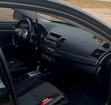 Черный Мицубиси Лансер, объемом двигателя 2 л и пробегом 211 тыс. км за 6900 $, фото 7 на Automoto.ua