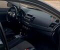 Черный Мицубиси Лансер, объемом двигателя 2 л и пробегом 211 тыс. км за 6900 $, фото 7 на Automoto.ua