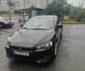 Черный Мицубиси Лансер, объемом двигателя 2 л и пробегом 229 тыс. км за 7300 $, фото 1 на Automoto.ua