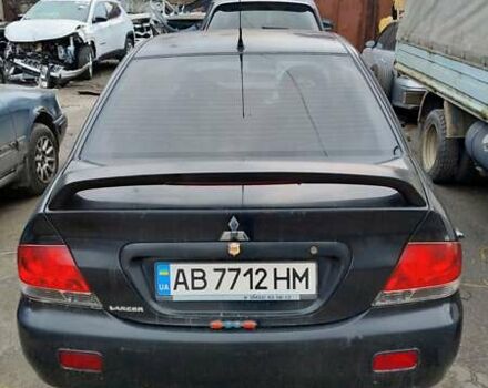 Черный Мицубиси Лансер, объемом двигателя 1.6 л и пробегом 200 тыс. км за 2000 $, фото 3 на Automoto.ua