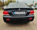 Чорний Міцубісі Lancer, об'ємом двигуна 1.6 л та пробігом 257 тис. км за 4200 $, фото 4 на Automoto.ua