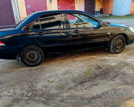 Черный Мицубиси Лансер, объемом двигателя 1.6 л и пробегом 230 тыс. км за 4700 $, фото 3 на Automoto.ua