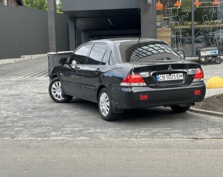 Черный Мицубиси Лансер, объемом двигателя 1.6 л и пробегом 168 тыс. км за 5662 $, фото 1 на Automoto.ua