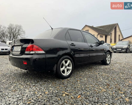 Черный Мицубиси Лансер, объемом двигателя 1.58 л и пробегом 202 тыс. км за 4100 $, фото 4 на Automoto.ua