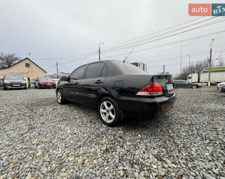 Черный Мицубиси Лансер, объемом двигателя 1.58 л и пробегом 202 тыс. км за 4100 $, фото 14 на Automoto.ua