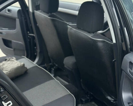 Чорний Міцубісі Lancer, об'ємом двигуна 1.5 л та пробігом 111 тис. км за 6999 $, фото 52 на Automoto.ua