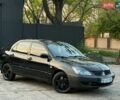Черный Мицубиси Лансер, объемом двигателя 1.6 л и пробегом 241 тыс. км за 3950 $, фото 1 на Automoto.ua