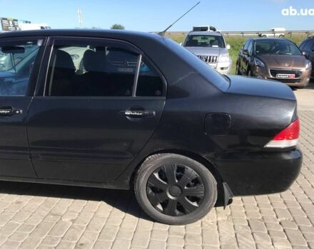 Черный Мицубиси Лансер, объемом двигателя 1.6 л и пробегом 356 тыс. км за 4590 $, фото 13 на Automoto.ua