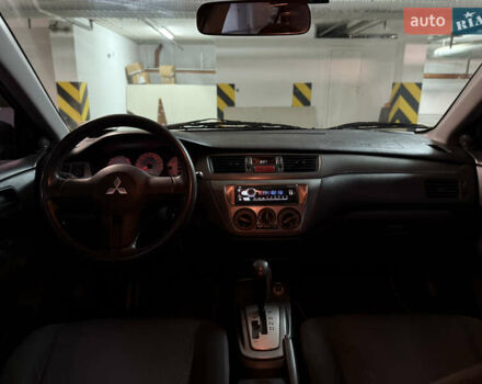 Чорний Міцубісі Lancer, об'ємом двигуна 1.58 л та пробігом 212 тис. км за 5500 $, фото 7 на Automoto.ua