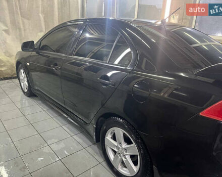 Черный Мицубиси Лансер, объемом двигателя 2 л и пробегом 200 тыс. км за 8000 $, фото 15 на Automoto.ua