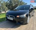Черный Мицубиси Лансер, объемом двигателя 2 л и пробегом 186 тыс. км за 7899 $, фото 1 на Automoto.ua