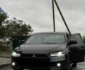 Черный Мицубиси Лансер, объемом двигателя 2 л и пробегом 140 тыс. км за 7200 $, фото 1 на Automoto.ua