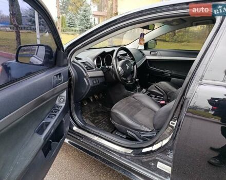 Черный Мицубиси Лансер, объемом двигателя 2 л и пробегом 200 тыс. км за 5100 $, фото 9 на Automoto.ua